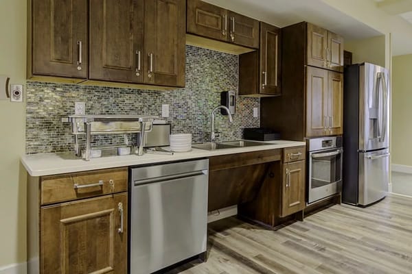 Well-equipped kitchen with wooden cabinets and stainless steel appliances