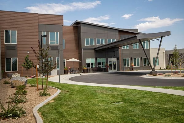 Exterior view of The Lodge at Greeley with landscaping