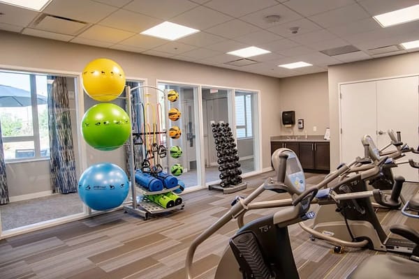 Well-equipped fitness room with exercise equipment