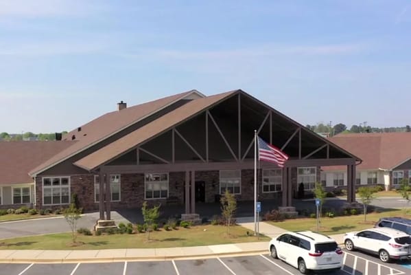 Exterior view of The Phoenix at Lake Joy with American flag.