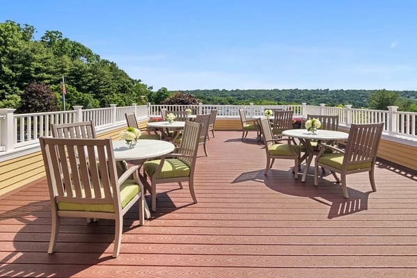 Outdoor seating area with tables and flowers