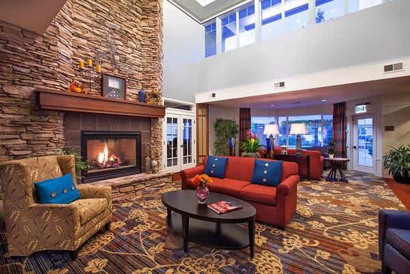 Cozy lobby area with fireplace and seating