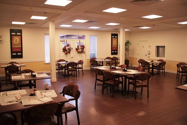 Interior dining room with tables and chairs set up