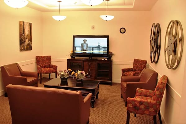 Cozy common area with seating and a TV