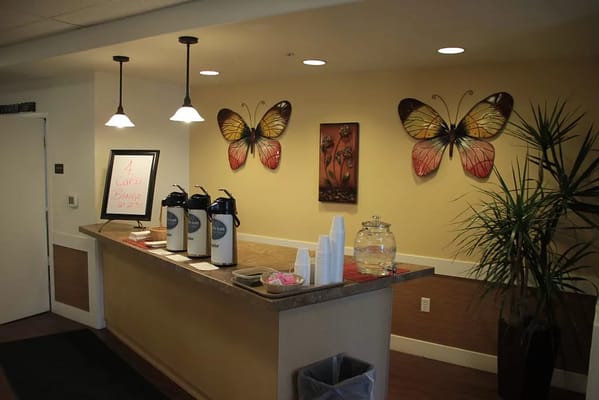 Interior common area with coffee service and butterfly decor