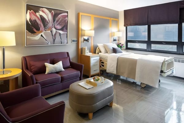 Brightly lit private room with comfortable furnishings