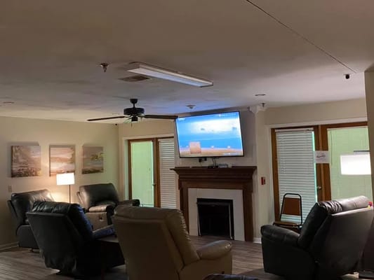 Common area with seating and television
