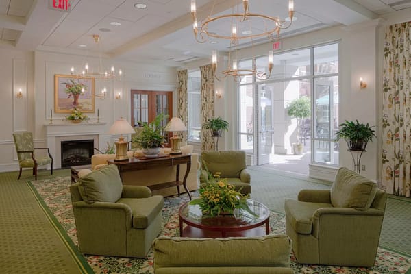 Bright common area with comfortable seating and greenery