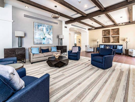 Spacious living room with comfortable seating and artistic decor