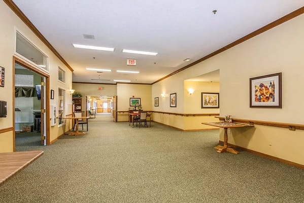 Bright interior hallway with artwork on the walls
