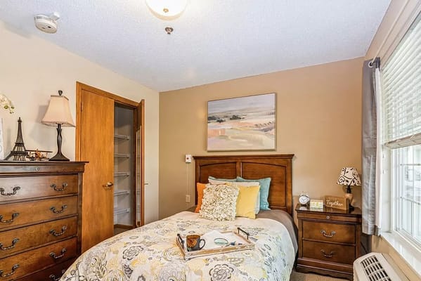 Cozy resident room with a bed and decorative touches