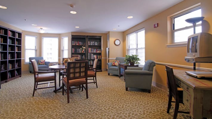 Bright common area with bookshelves and seating