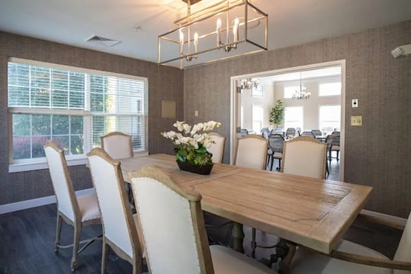 Bright dining area with a large wooden table