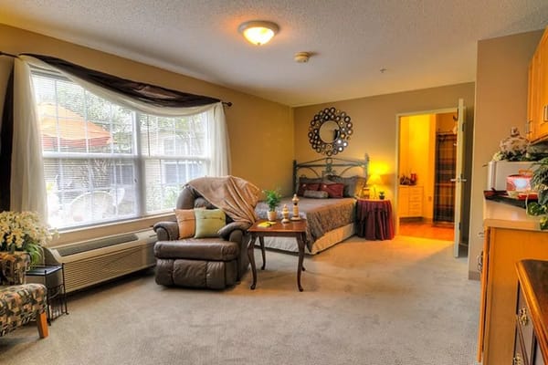Cozy resident room with comfortable furniture and natural light