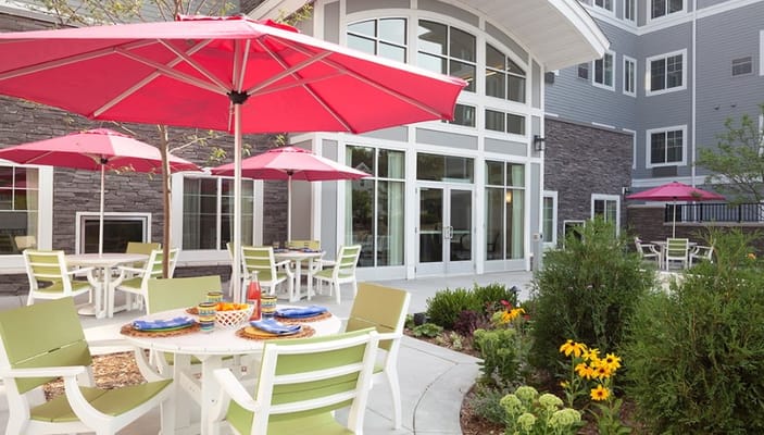 Outdoor patio area with tables and umbrellas