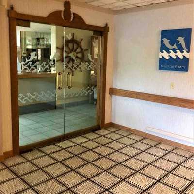 Entrance to the Nautical Room with glass doors