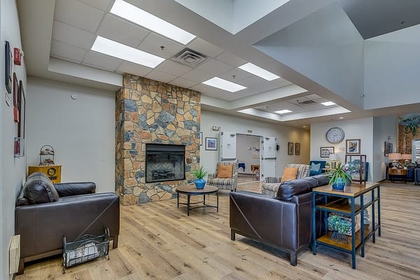 Cozy lobby area with seating and fireplace