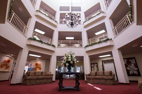 Bright and welcoming lobby with floral arrangement