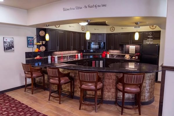 Interior kitchen area with bar seating and decor