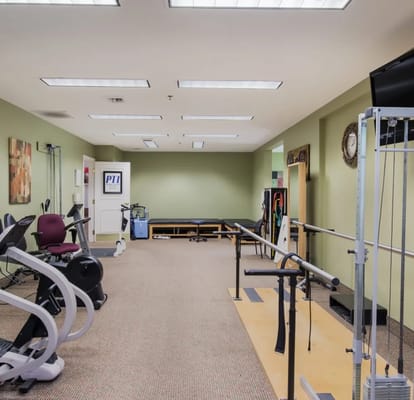 Interior of a physical therapy room with exercise equipment