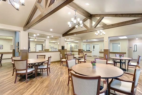 Cozy dining area with wooden tables and chairs