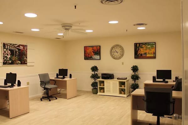 Bright activity room with desks and decor