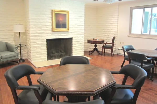 A bright interior living area with furniture and a fireplace