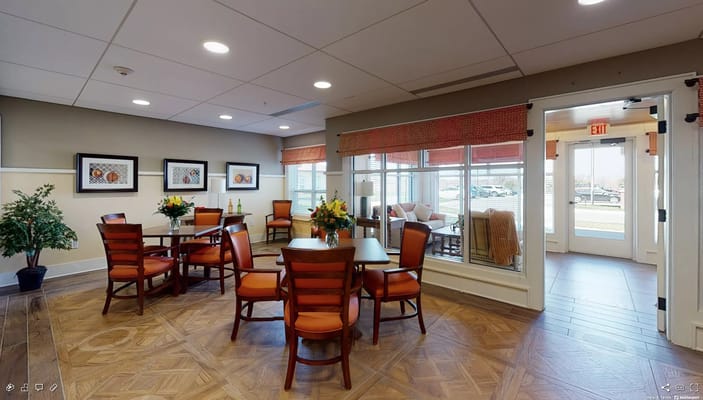 Bright common area with tables and chairs