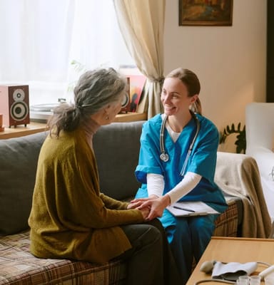 Healthcare professional interacting with a senior resident