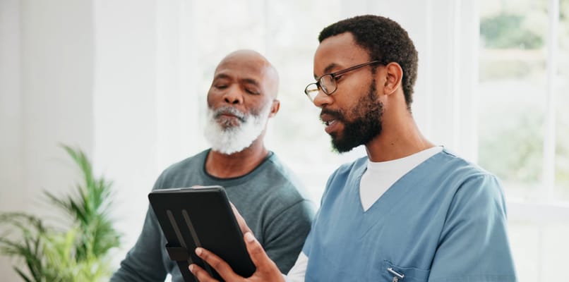 Healthcare professional interacting with a senior resident