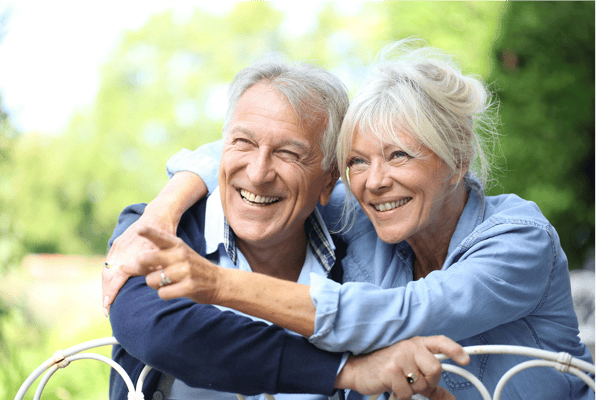 Happy elderly couple enjoying time outdoors