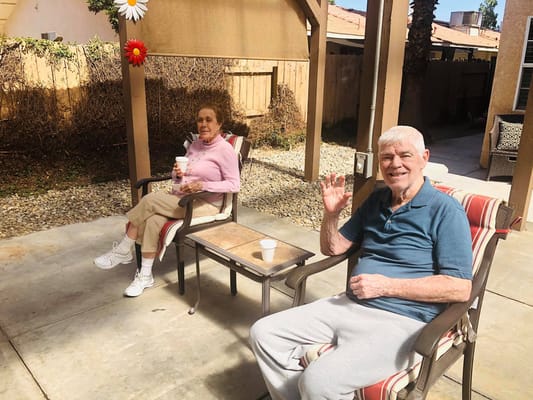 Residents enjoying time outdoors in a garden area