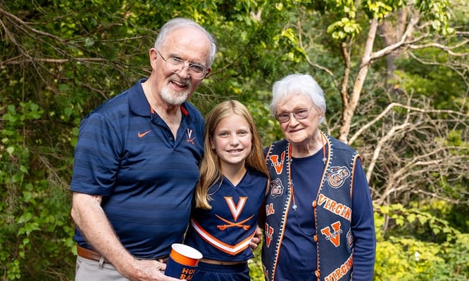 Elderly couple with a young girl outdoors