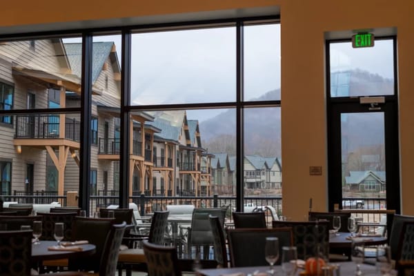 View from the dining room showcasing outdoor space and buildings