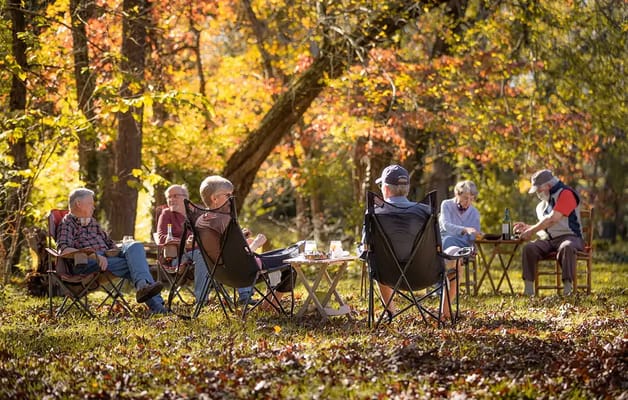 Residents enjoying a gathering in a scenic outdoor space