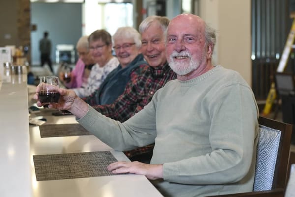 Residents enjoying drinks together at a social gathering
