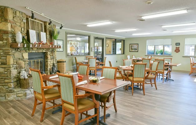 Dining area with tables and chairs in a well-lit room