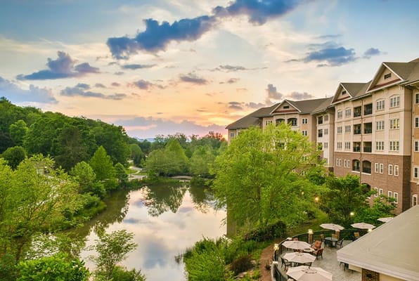 Exterior view of a senior living facility at sunset