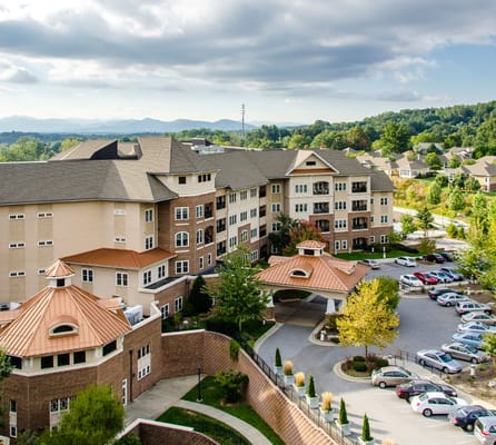 Aerial view of a senior living facility with parking
