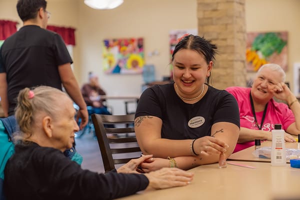 Staff interacting with a resident in a common area