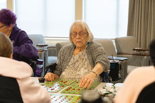 Residents enjoying a game of bingo in an activity setting