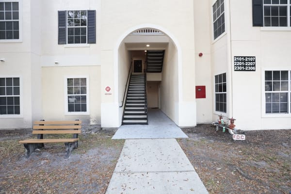 Entrance to a senior living facility with stairway access