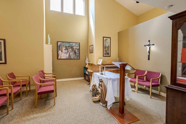 A serene chapel area with chairs and religious decor