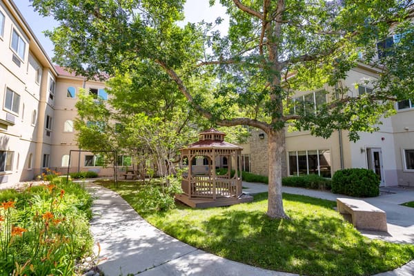 A peaceful courtyard with a gazebo and greenery