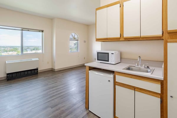 A kitchen area in a resident's living unit