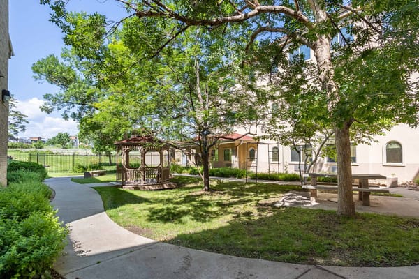 A serene outdoor space with a gazebo and walking path