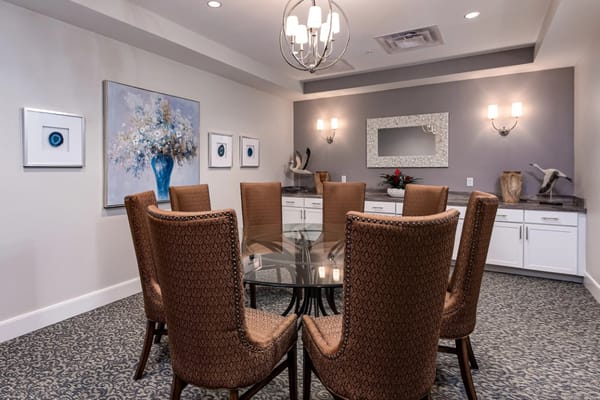 Elegant dining area with chairs and artwork