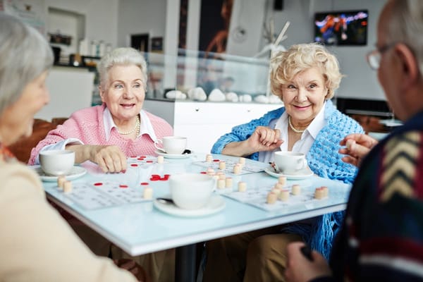 Residents enjoying a game night with coffee