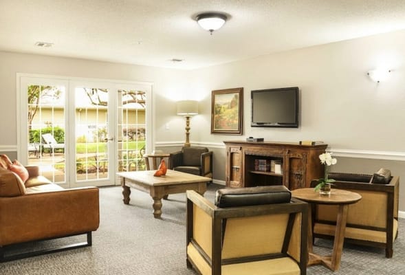 Bright common area with seating and a view to outdoors