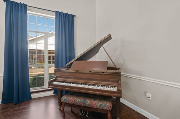 Piano in a sunlit corner of the facility